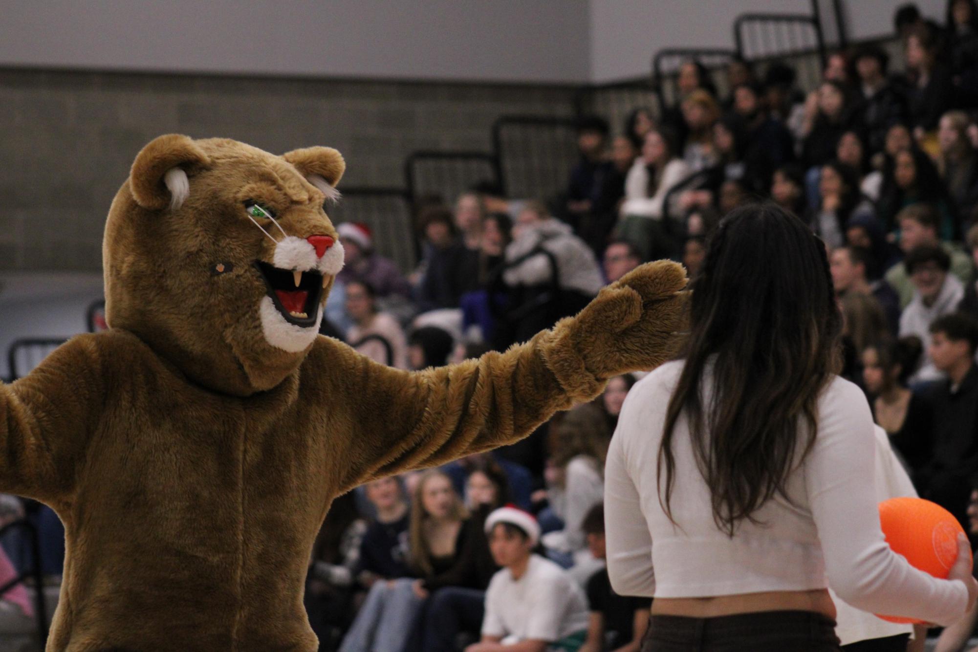 Cirillo blocking a student as they try to throw a dodgeball at the opposing team.