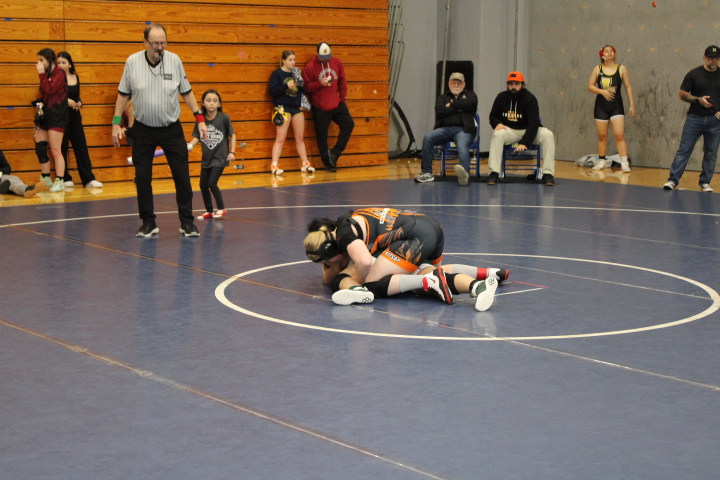 Jasmine Sullivan as she holds down her opponent moments before her victory.