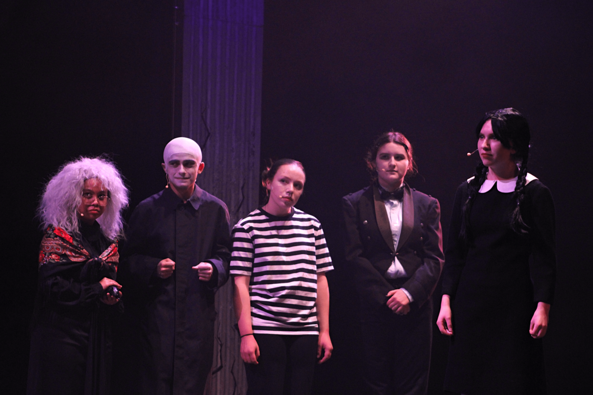 (Left to right) Li-Mei Co, Micah Kaczynski, Lillian Johnson, and Alyssa Elkins line up behind Hannah Baugh on stage.