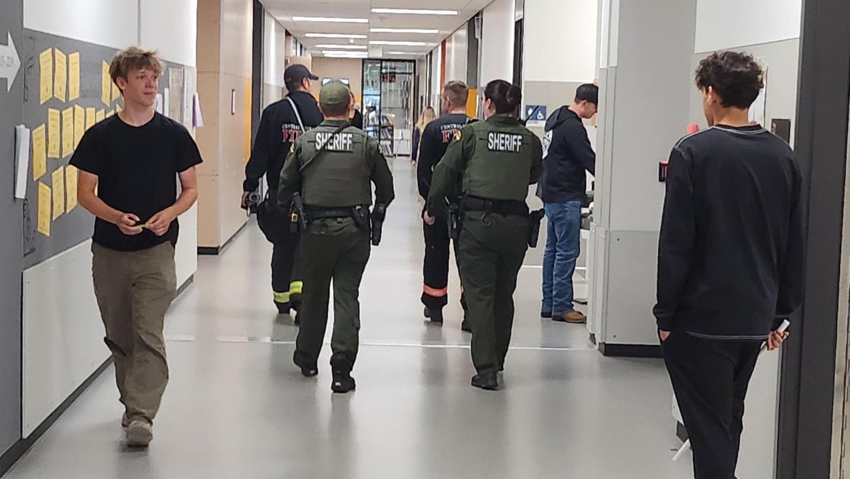 School Resource Officer, sheriff, and fire fighters respond to the chromebook explosion in Erik Randall's class.