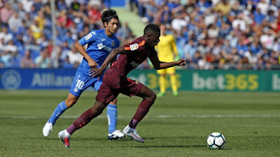 Ousmane Dembélé dribbles the ball away from the other team, exemplifying his talent as a young athlete. (Provided by Miguel Ruiz-FCB)