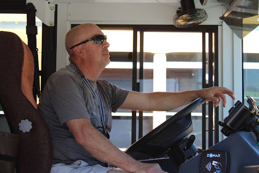 Michael Avery watches as CKHS students board his bus on his afternoon high school route.
