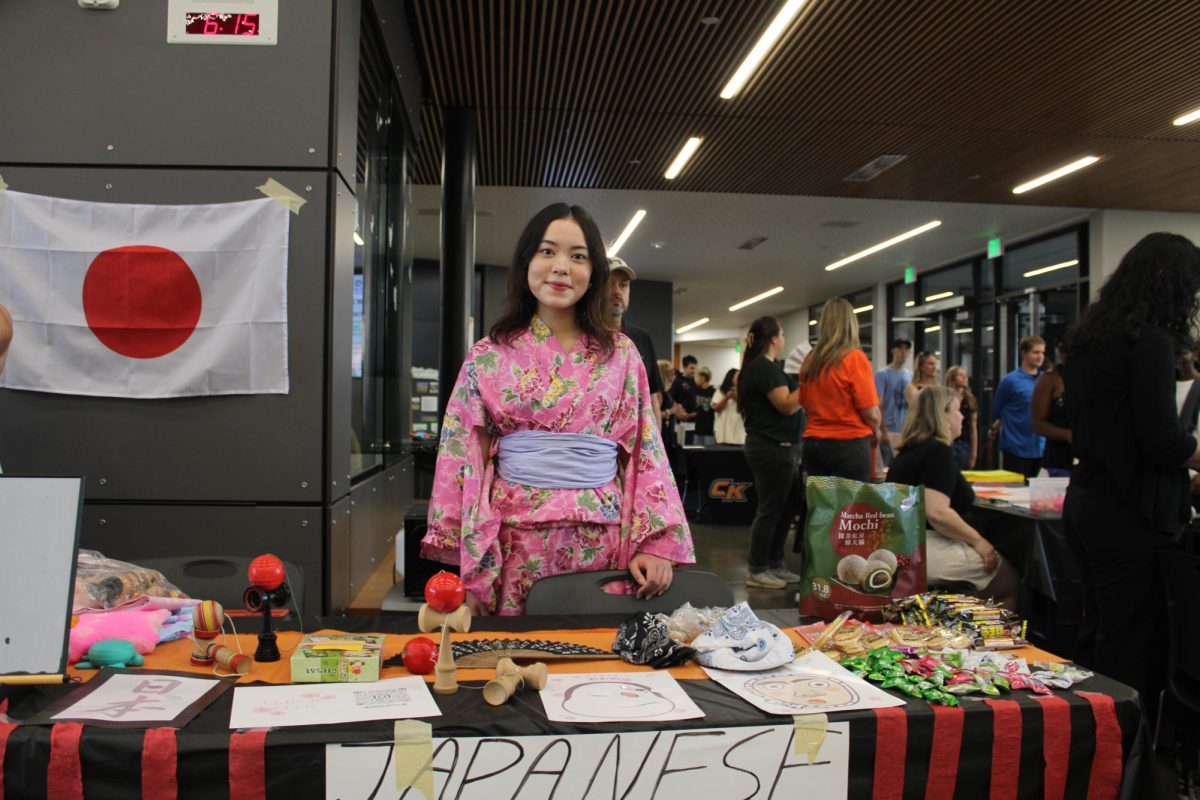 Kiana Roth stands at the Japanese Culture Club booth.