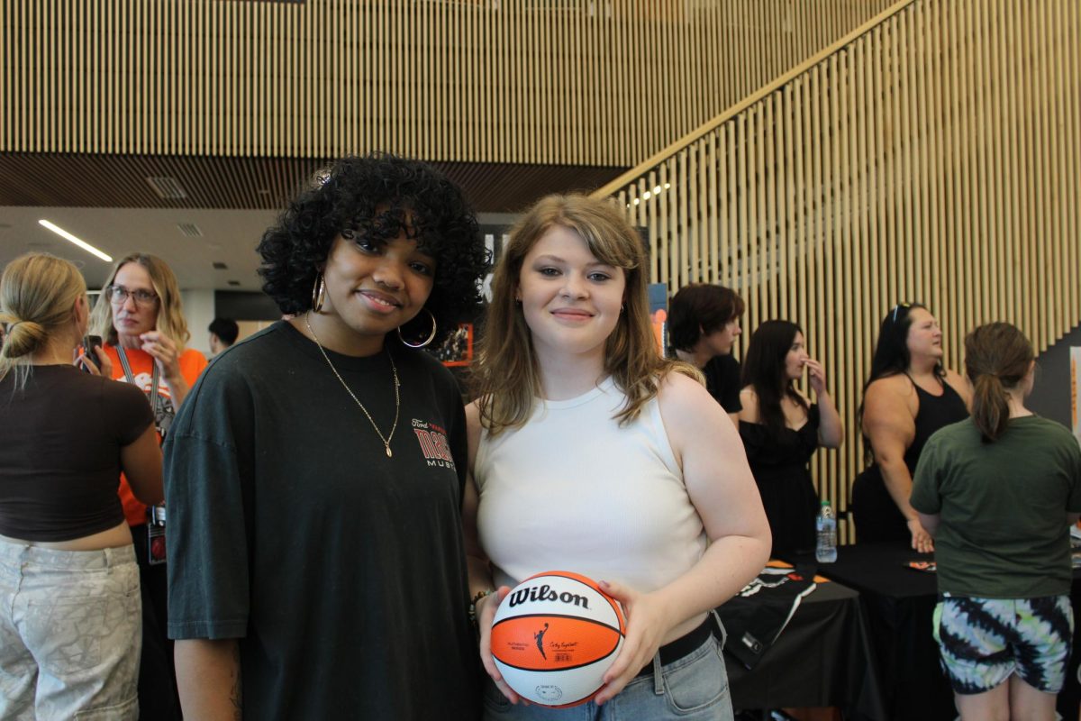 Angela Clay (left) and Samantha Hampton (right) pose for a photo.