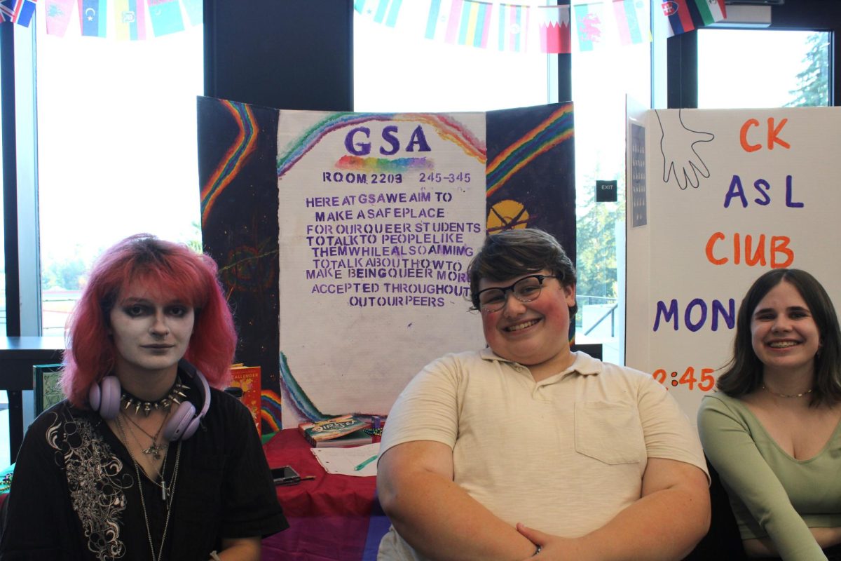 Haylee Onak (left), Samuel Campagna (center), and Delaney Kish (left) talk to guests about the Gender and Sexuality Awareness Club.
