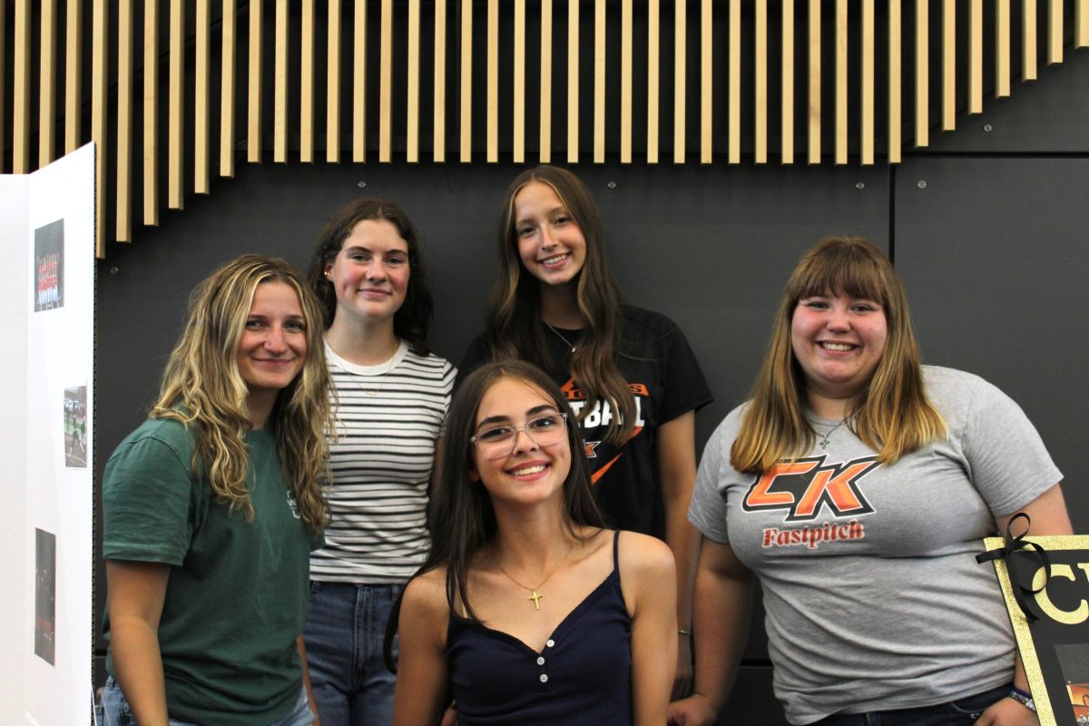 Izzy Griffin (top left), Ariana Linder (top right), Brooklyn Gordon (bottom left), Emma Leach (bottom center), and Scarlett Mabe (bottom right) pose for a photo.