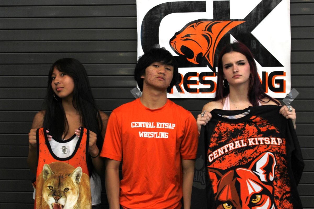 Paola Vicente (left), Keane Sager (center), and Madeline Johnson (right) pose for a photo.