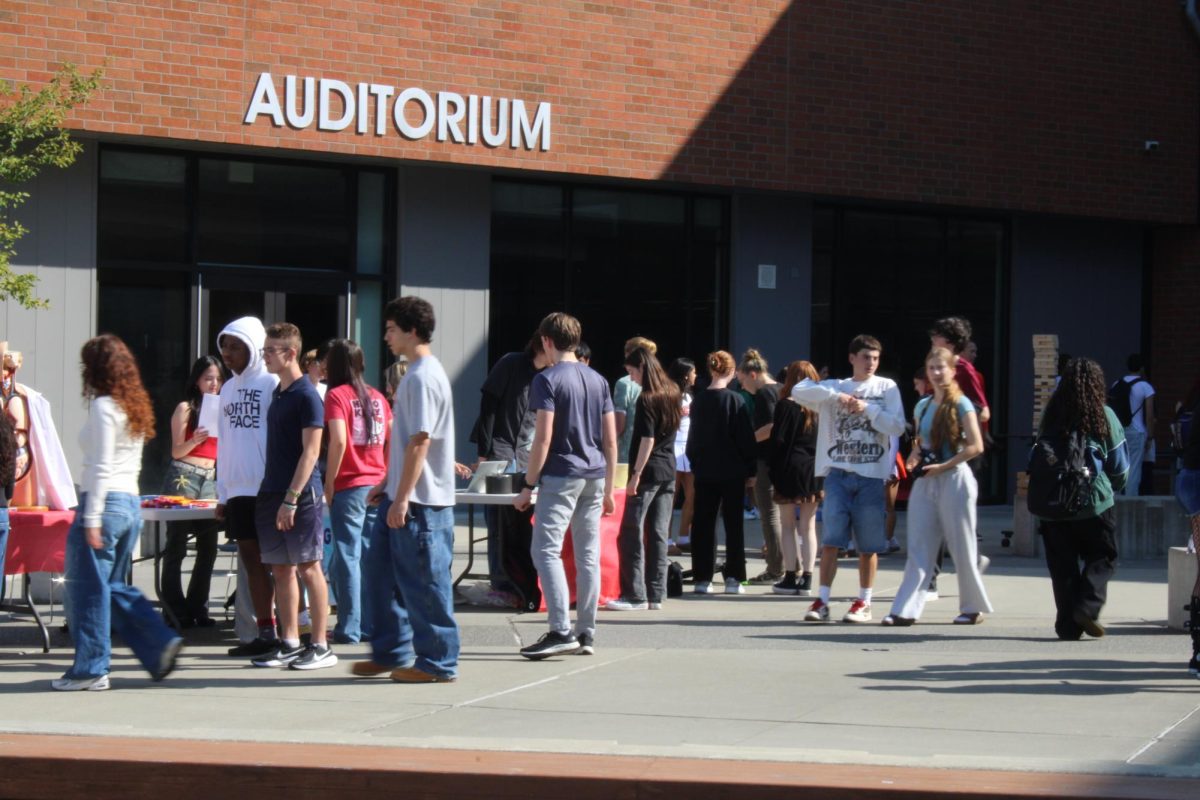 Central Kitsap High School students explore the booths at the tailgate.
