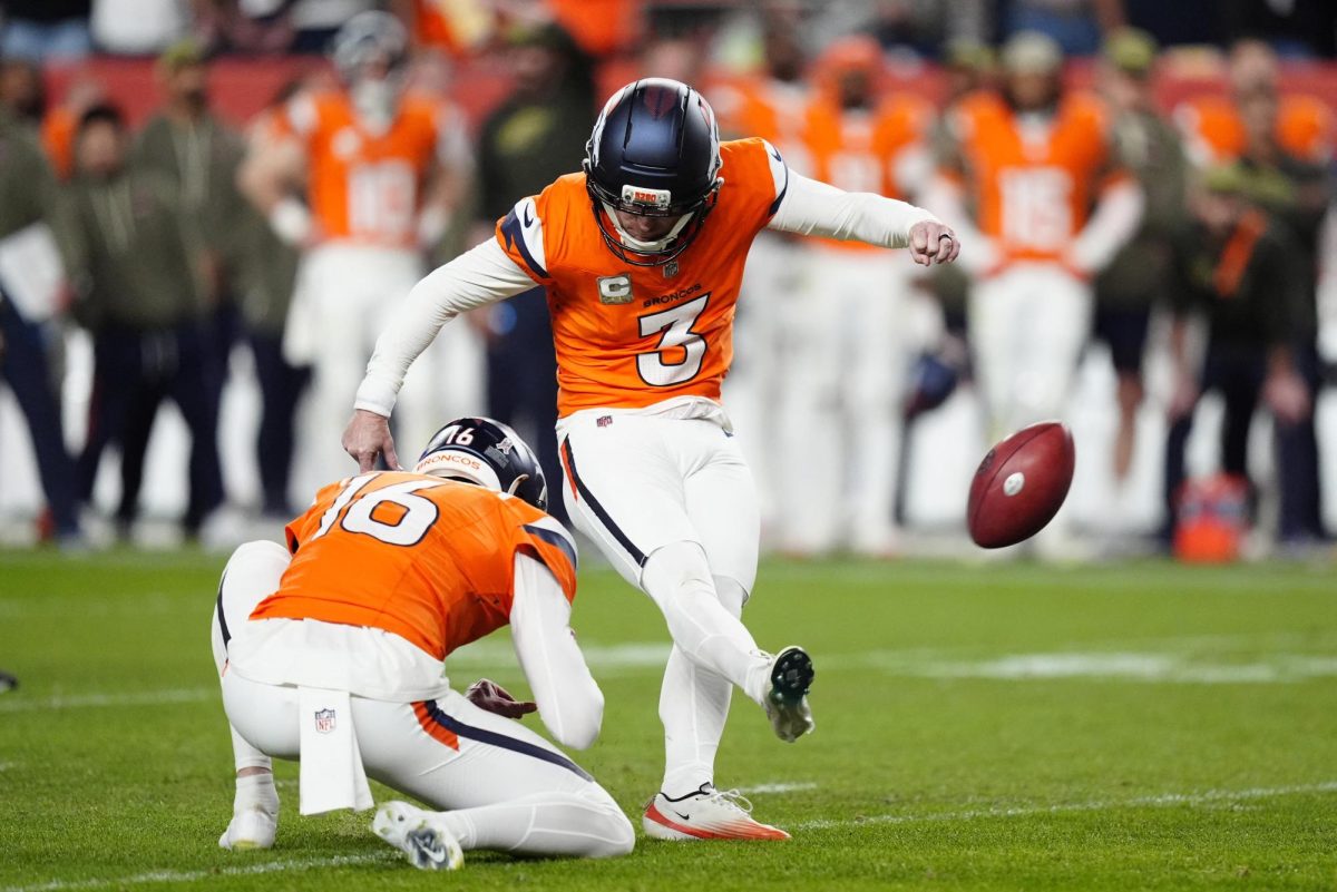 Denver Broncos kicker Wil Lutz (3) kicks the game winning field goal as punter Jeremy Crawshaw (16) assists. (Ron Chenoy-Reuters Images)