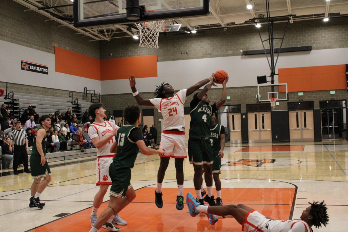 DJ Richardson (#24) blocks a shot expertly.