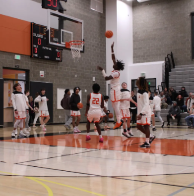 Central Kitsap Boy’s Basketball Varsity Team players warm up before the game.