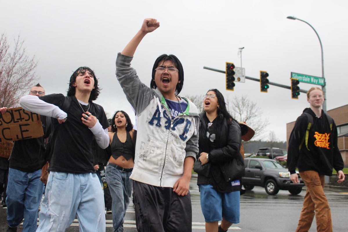 Students shout and chant down Silverdale Way NW during the ICE protest.