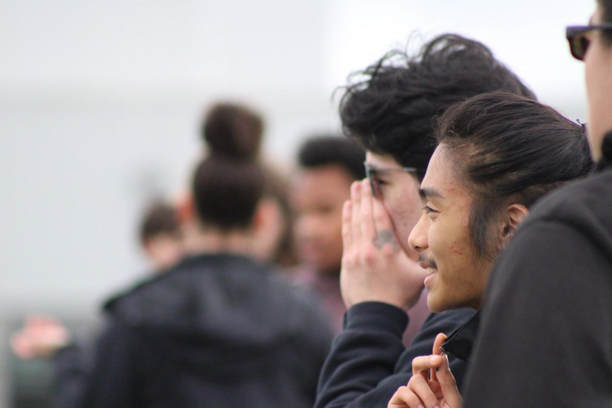 Track students prepare for a warm up during practice.