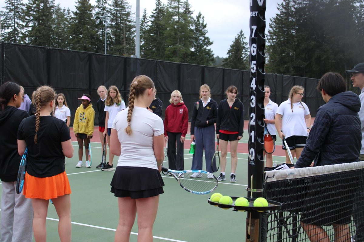 Head Coach Hibbs Turner gives words of encouragement to the team before the matches.