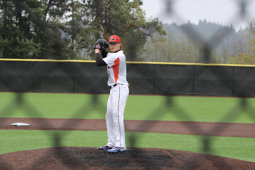 Pitcher Jackson Brady (#15) preparing to deliver a pitch