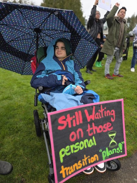 During the St. Michael protest on March 20, Noelle's son, along with other participants, combats the closure with signs. (Provided by Noelle Pacl)