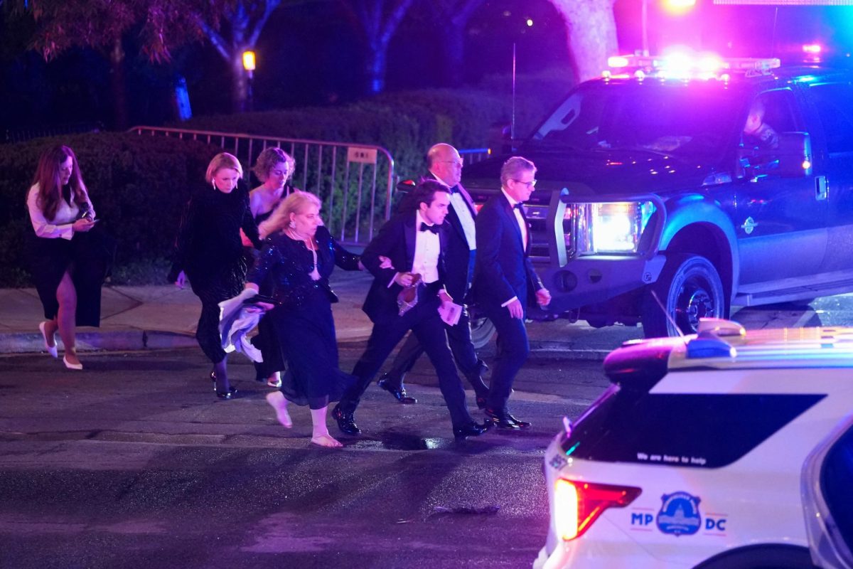 Attendees leave the venue as a shooter opens fire during the annual White House Correspondents' Association dinner in Washington, D.C., U.S., April 25, 2026. REUTERS/Ken Cedeno