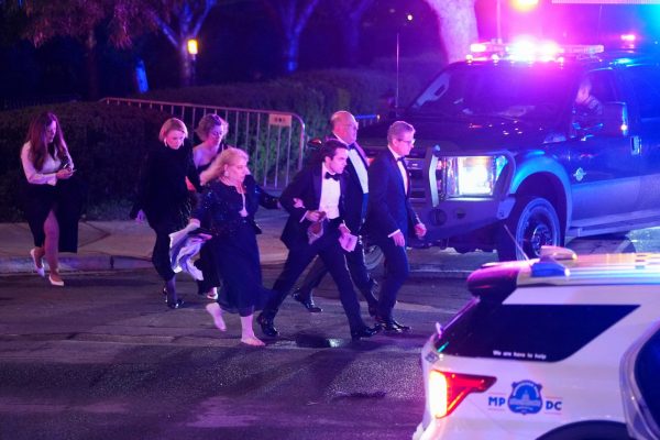 Attendees leave the venue as a shooter opens fire during the annual White House Correspondents' Association dinner in Washington, D.C., U.S., April 25, 2026. REUTERS/Ken Cedeno