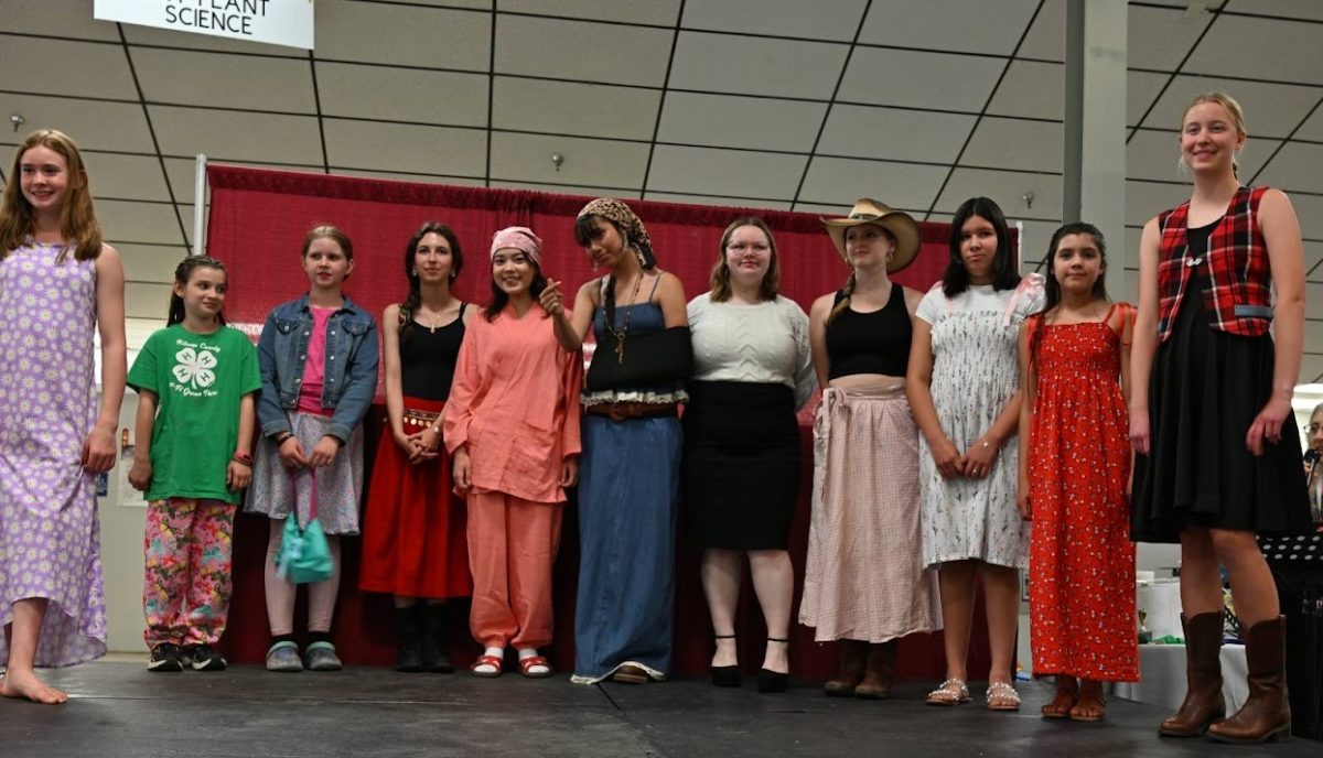 4-H youth receive their awards in the textile contest titled Fashion Revue, where they were judged on construction, interview, and modeling. (Provided by Yoko Roth)