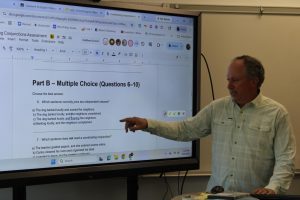 Kevin McCarthy explains an assignment to his English 9 class.  